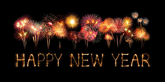 Happy New Year made of sparkles firework at night